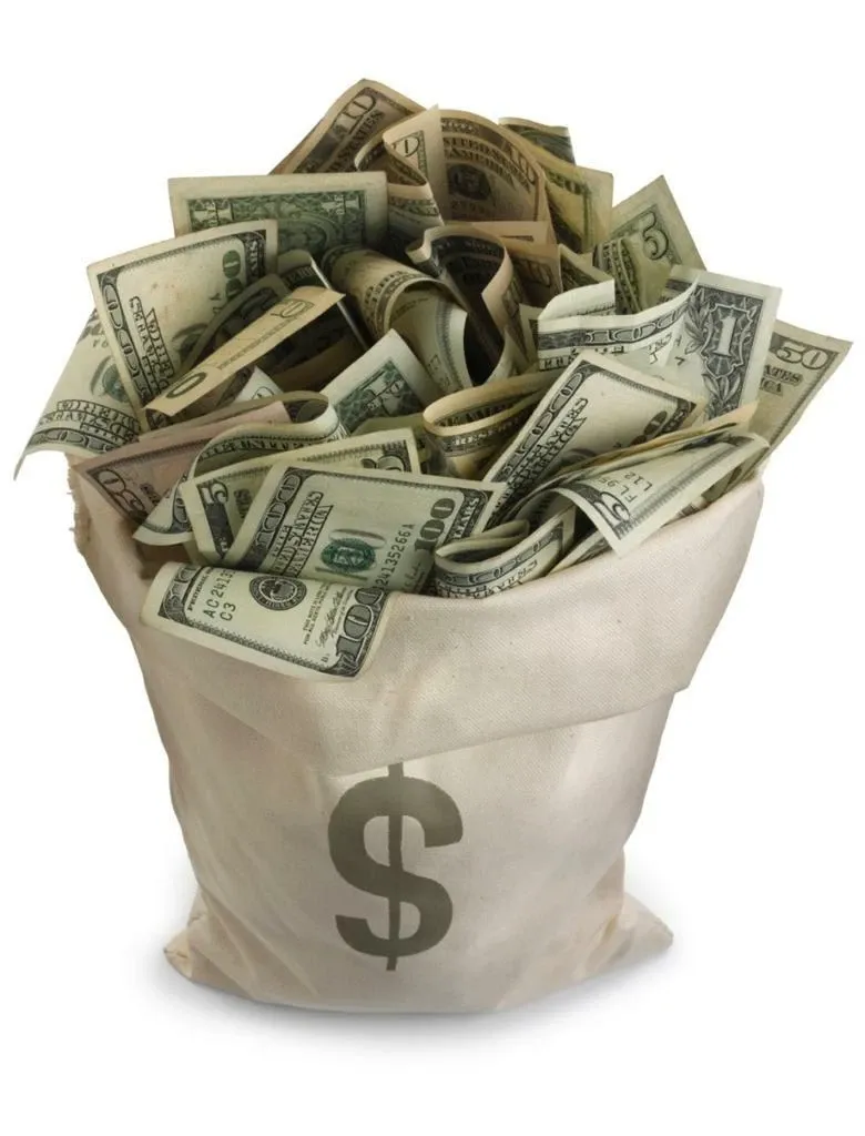 A cream money bag overflowing with U.S. dollar bills