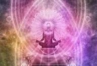A meditative silhouette surrounded by soft pink and lavender light